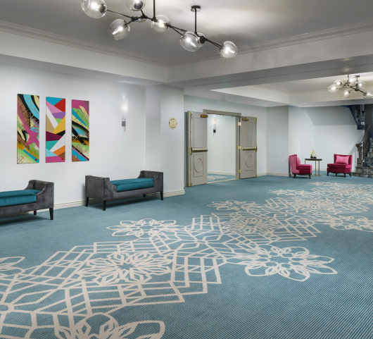 hallway inside the marker with blue carpet and chairs