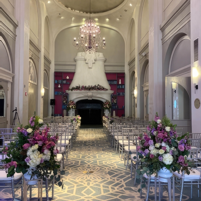 Wedding venue set up for service with beautiful arrangements of flowers