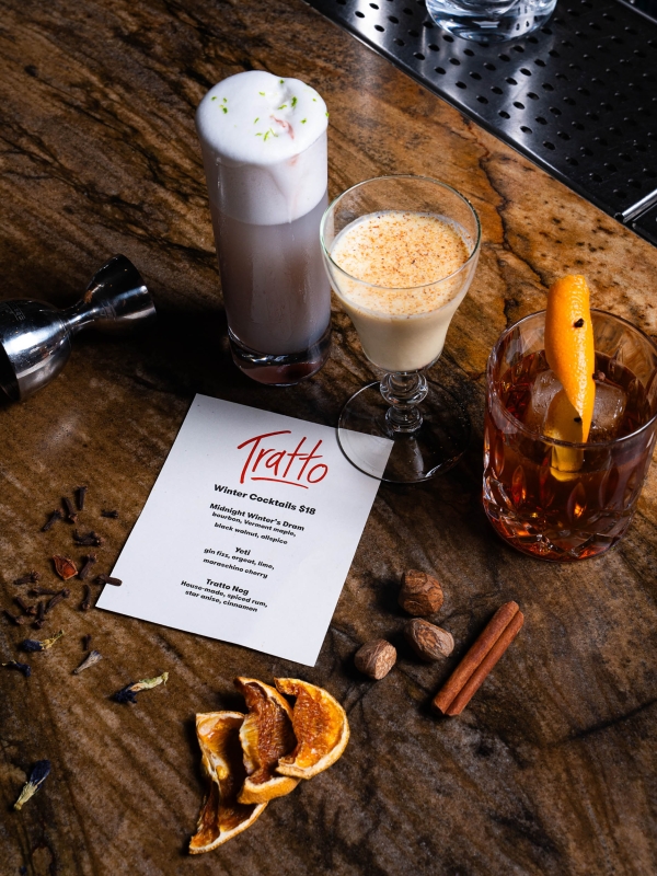 Close up of drinks and a menu for Tratto at The Marker