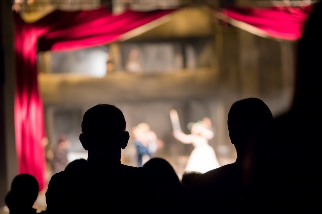 silhouettes of people enjoying a play at the golden gate theatre