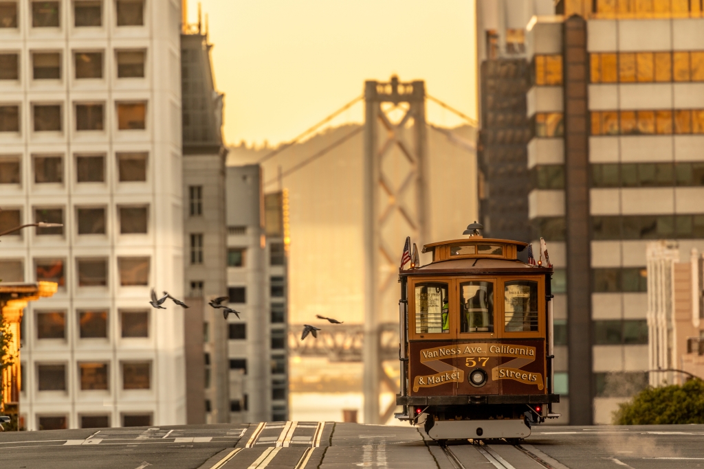 View of the San francisco nob hill cable car with the golden gate bridge in the background