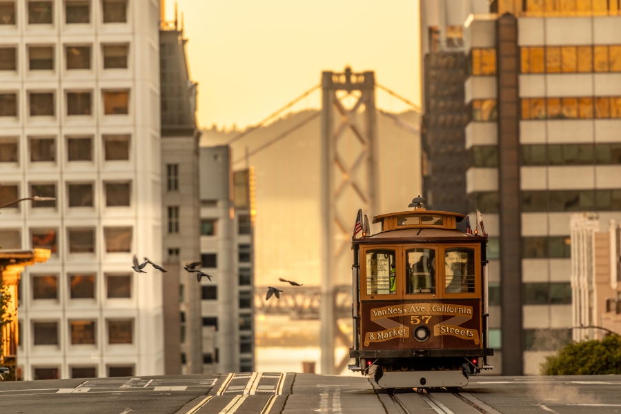 View of the San francisco nob hill cable car with the golden gate bridge in the background