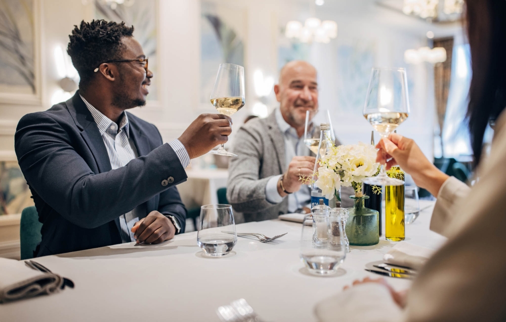 A group of people enjoying drinks while at a meeting at The Marker