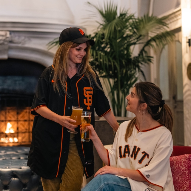 Two women enjoying drinks at The Marker