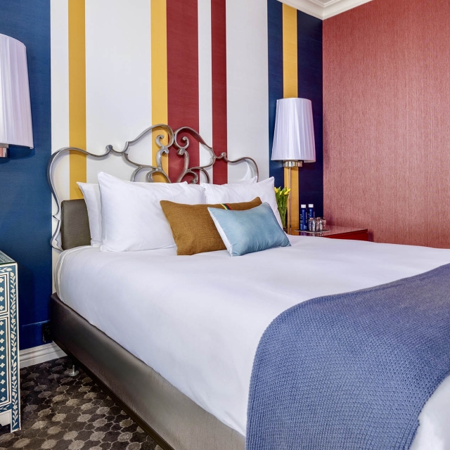 Side view of a bed in a room at The Marker