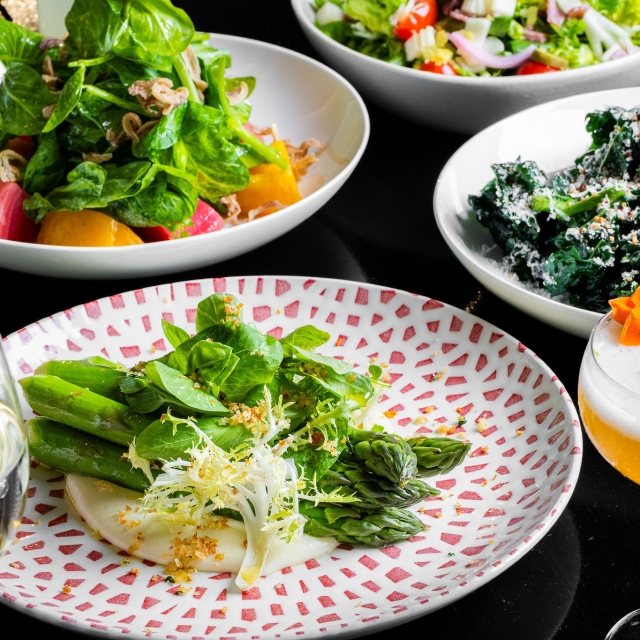three salads and a cocktail prepared by tratto restaurant in marker hotel in san francisco